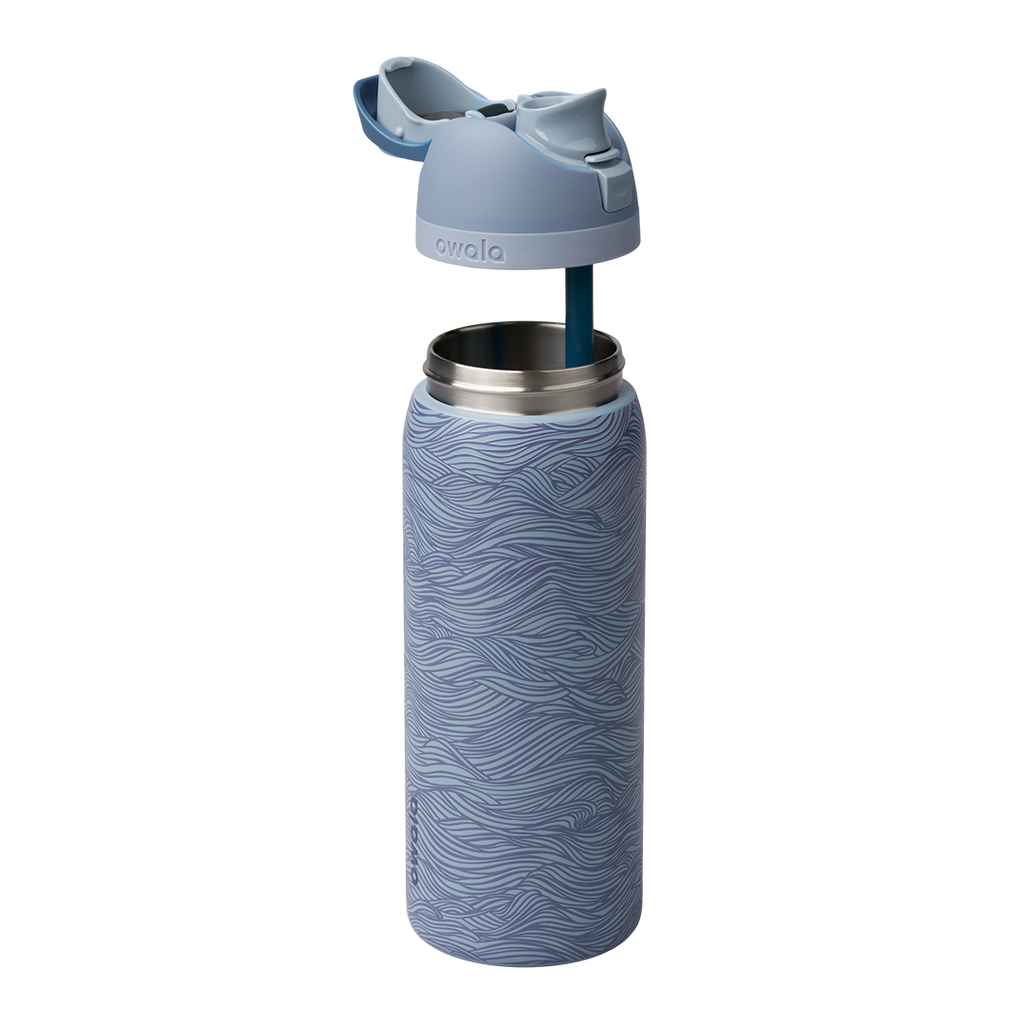 Owala FreeSip 32oz exploded view, slate blue body with wave texture shown with lid lifted off revealing the silicone straw and stainless steel interior